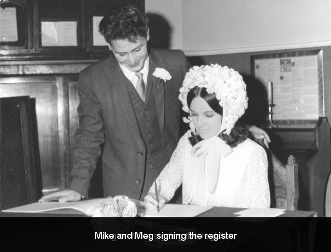 Mike and Meg signing the register